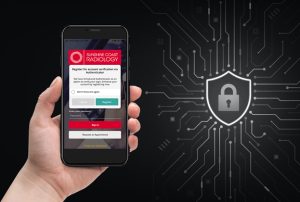 Sunshine Coast Radiology IQ Vue patient image and report viewing app on a mobile phone held in left hand