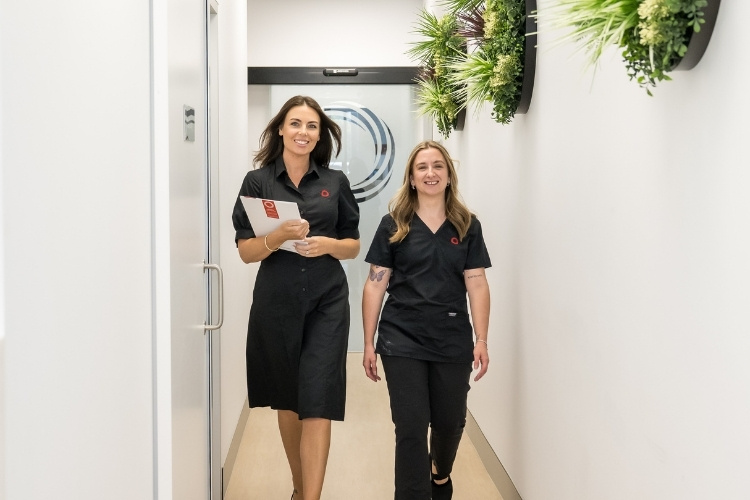 Administrator and Radiographer walking down passage at Sunshine Coast Radiology.