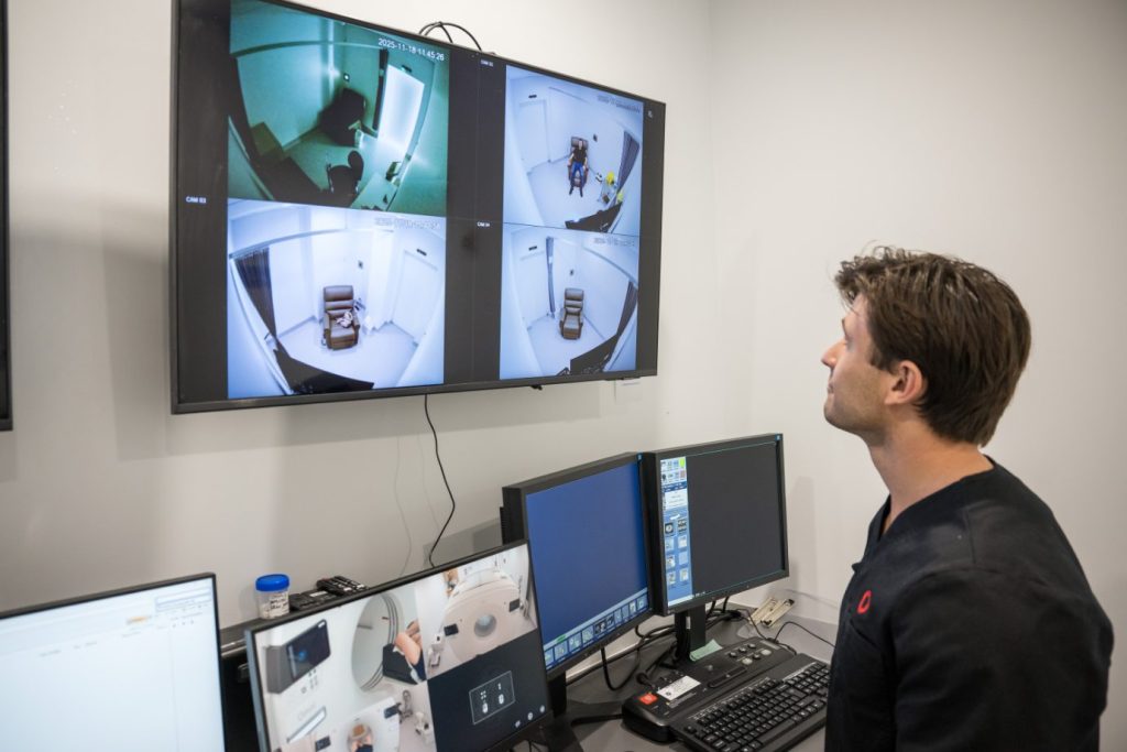 Sunshine Coast Radiology Nuclear Medicine Technician checks on patient via camera
