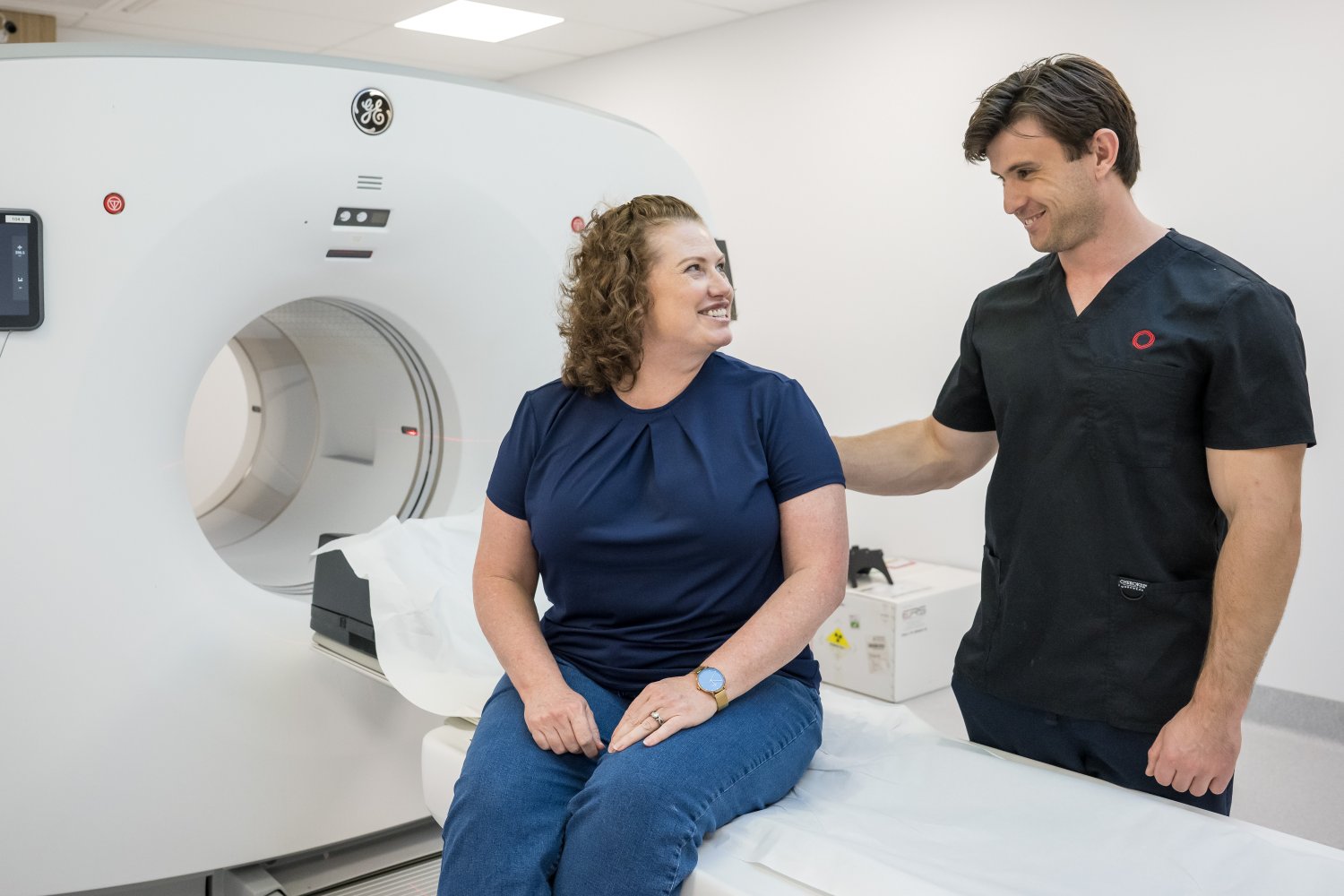 Nuclear Medicine Technician helping patient about to have a PET/CT scan at Sunshine Coast Radiology
