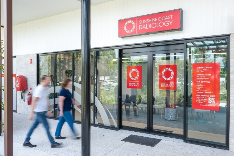 Two patients walk to Sunshine Coast Radiology clinic entrance.